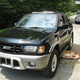 Illustration for article titled For $4,650, This 2002 Isuzu Rodeo Will Flip Its Lid, And That’s No Lie